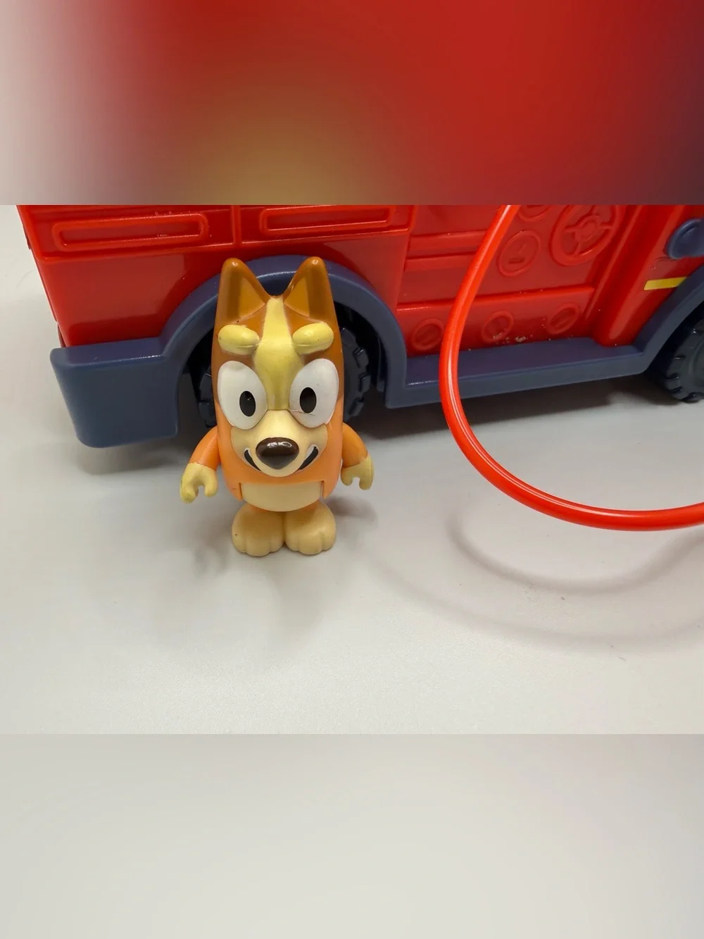 Disney Bluey fire truck playset toy with bingo bluey figure